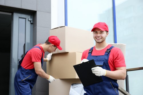 Man and van removal team loading furniture in Crystal Palace