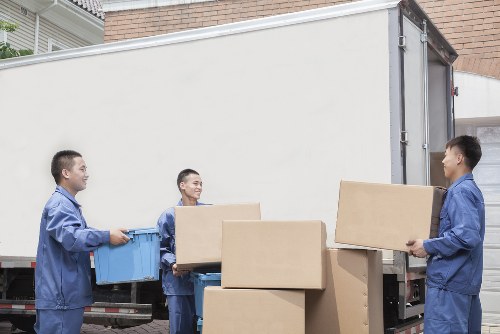 Packed office boxes and furniture prepared for a local business move