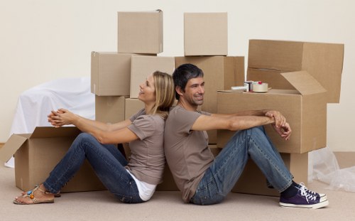 Removal crew handling furniture in a Crystal Palace property